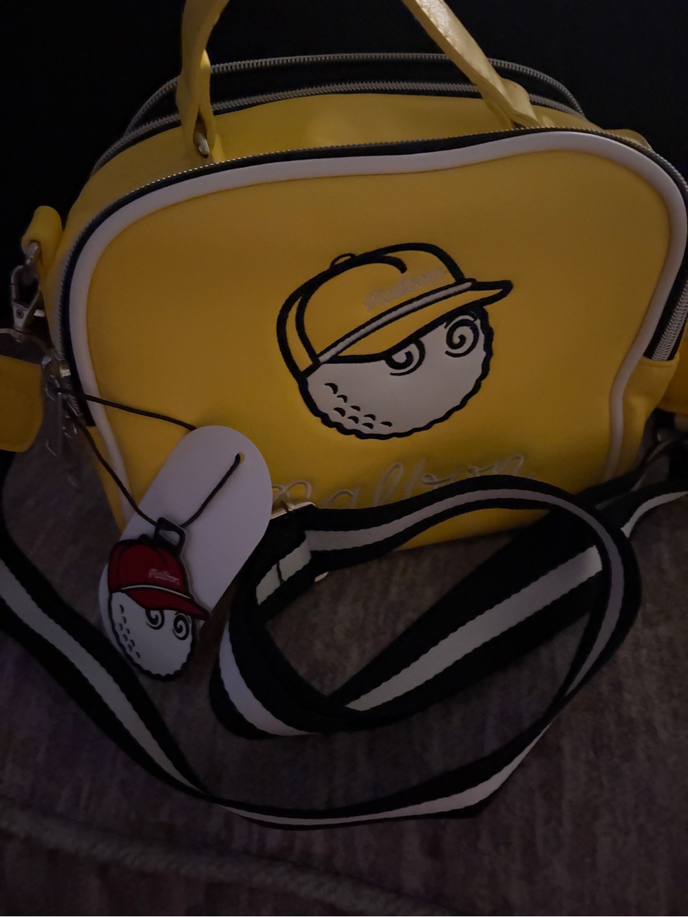Malbon yellow cross body shoulder bag.